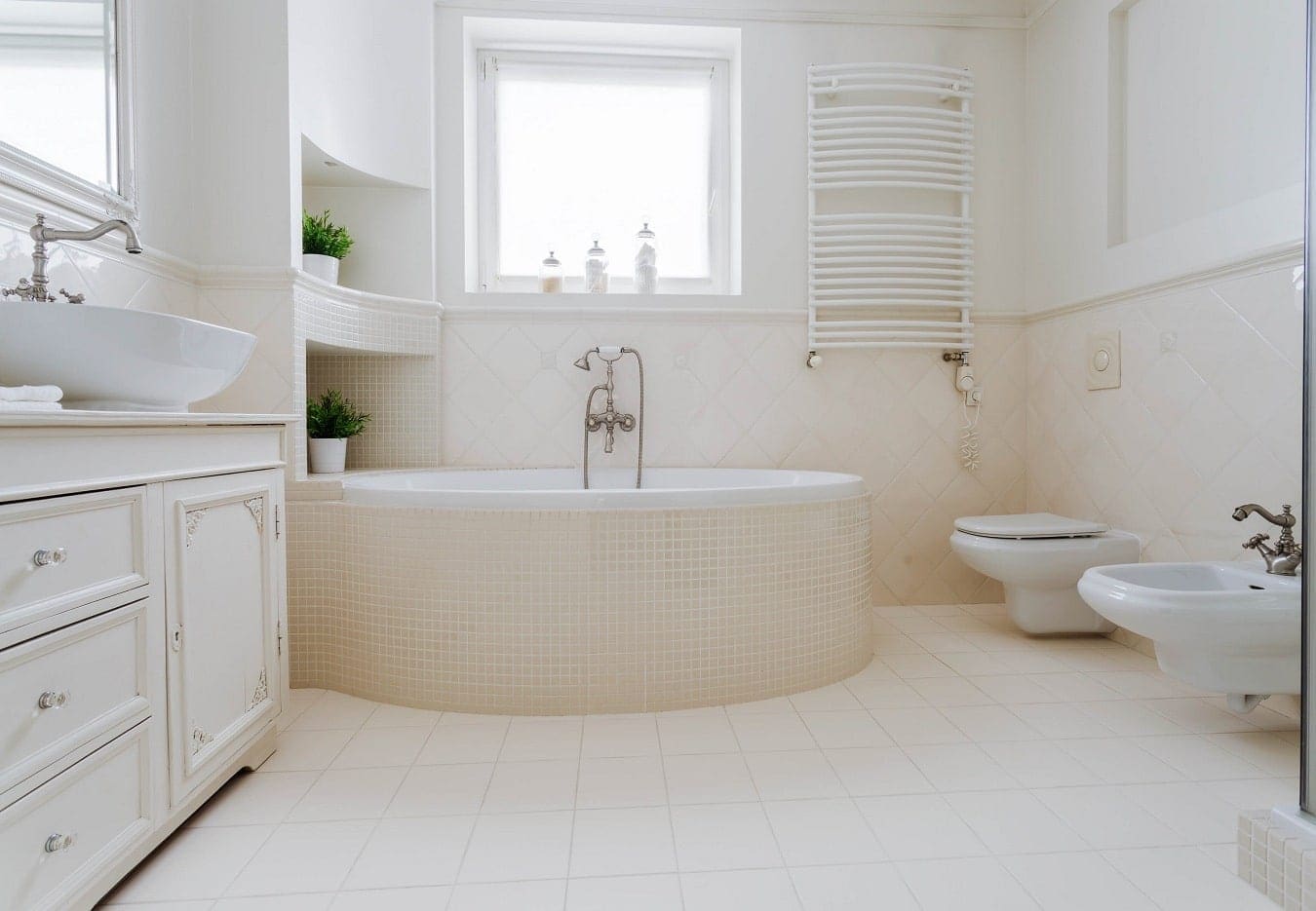 Bright refinished bathroom with a like-new bathtub and tile by Renov8 Co.
